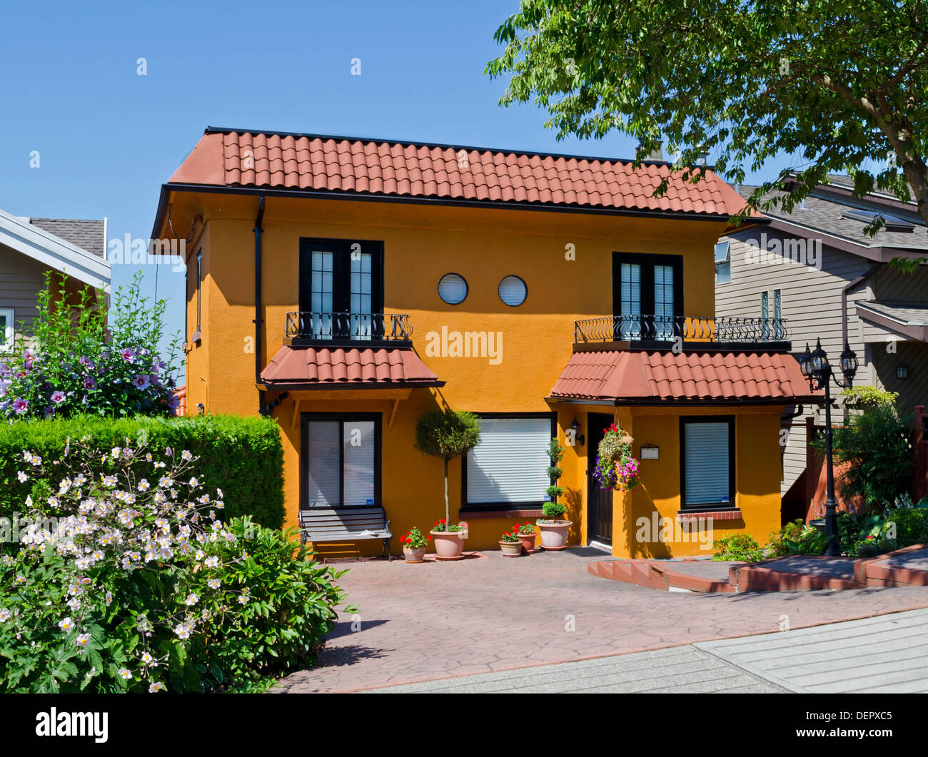 Spanish style home with vibrant warm colours in Burnaby, part of Greater Vancouver, Canada. Stock Photo