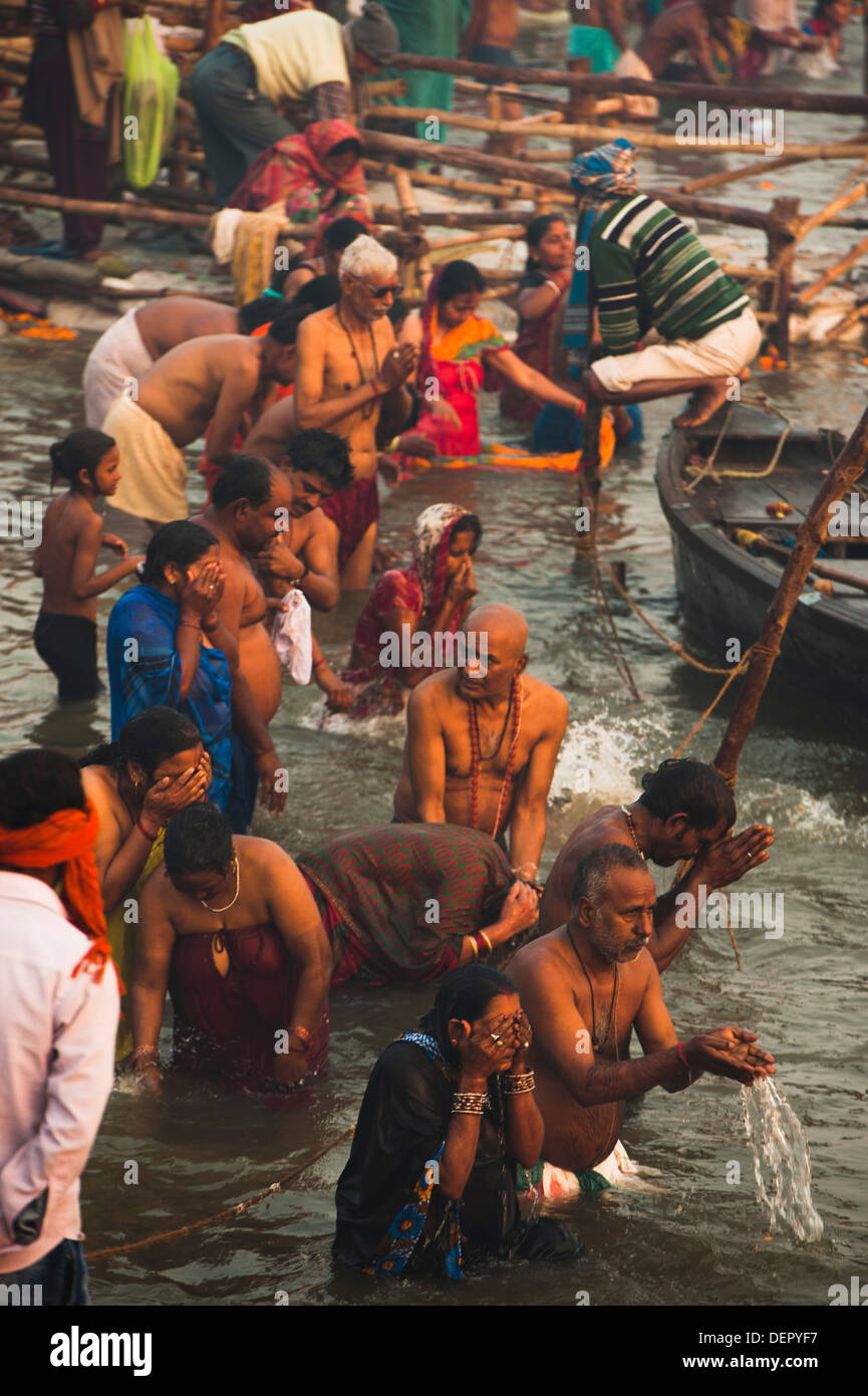 Pilgrims taking a holy dip in Ganges River at Maha Kumbh, Allahabad, Uttar Pradesh, India Stock Photo