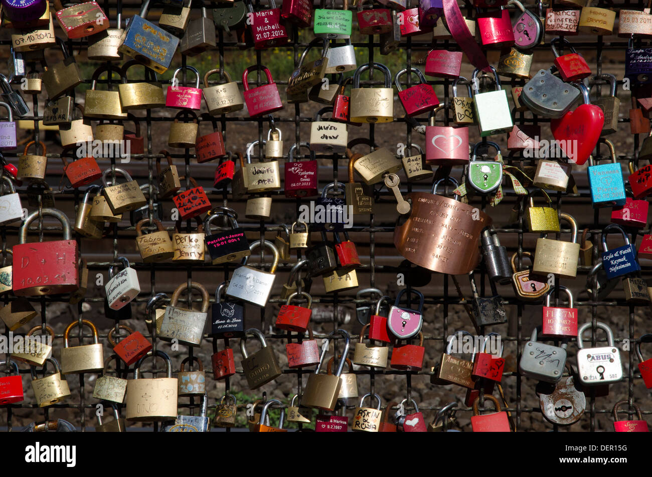 close up of love token padlocks on bridge over the river rhine cologne germany Stock Photo