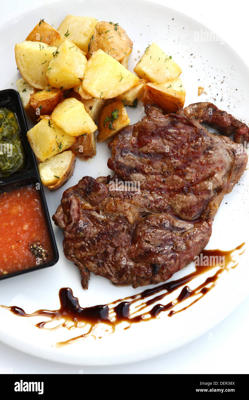 Char Grilled fillet beefsteak with baked potato Stock Photo