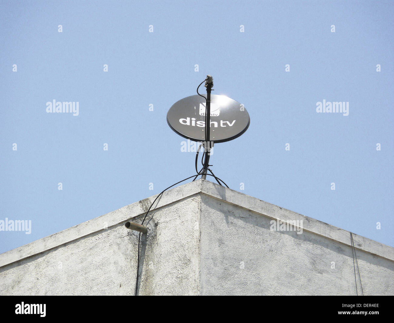 A dish antenna of a television set on a building terrace. Pune