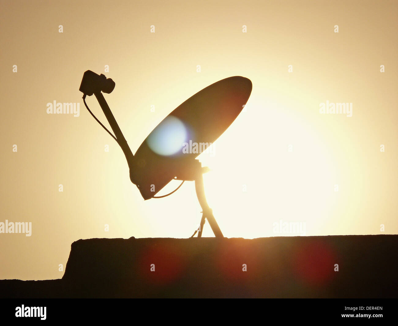 A dish antenna of a television set on a building terrace. Pune