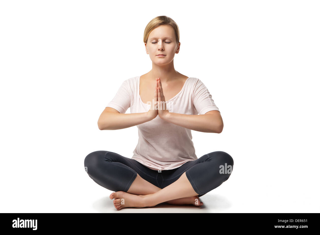 Young woman doing yoga isolated against white background Stock Photo ...