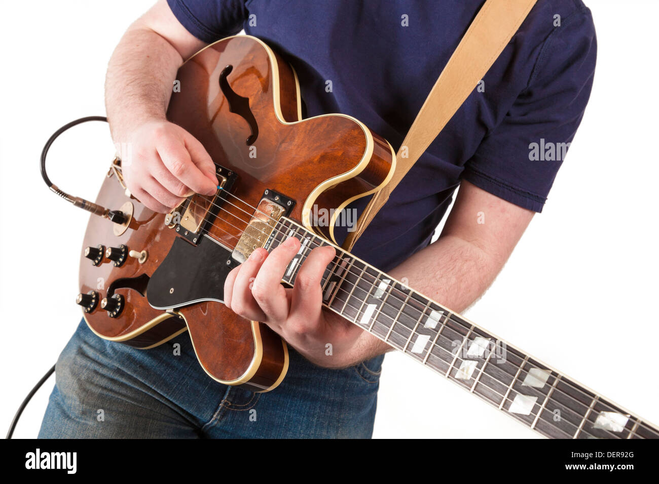 Young guitarist. Man playing an electric guitar Stock Photo