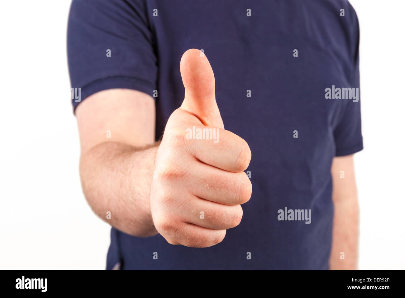 Young man giving a thumbs up sign Stock Photo