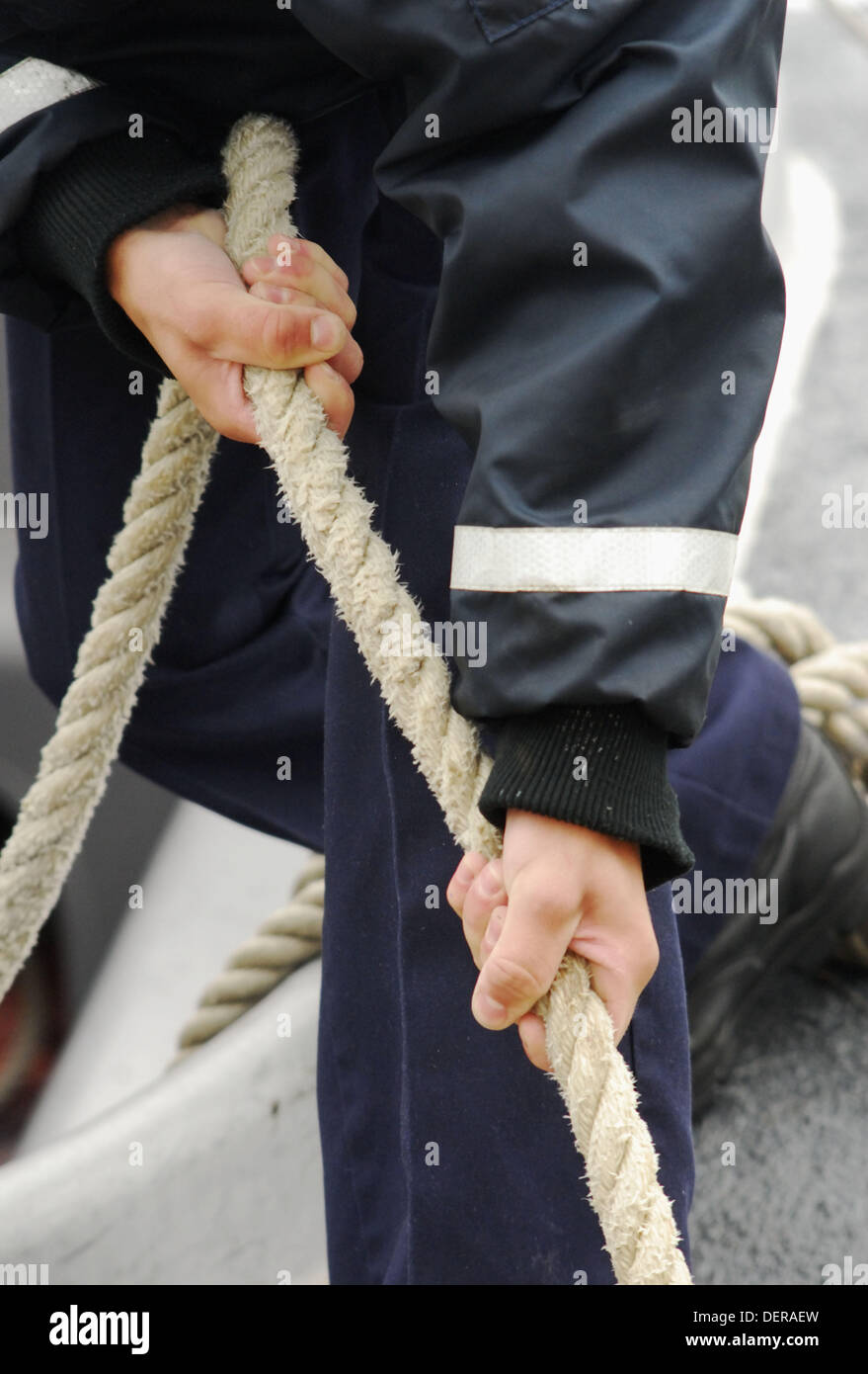 A sailor pulling a rope Stock Photo Alamy
