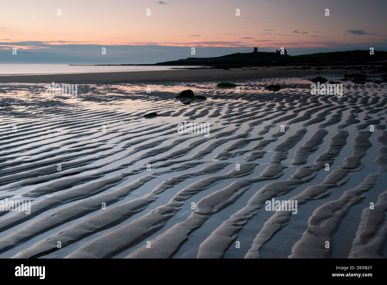 Dunstaborough Castle and Embleton Bay at dawn. Northumberland, UK Stock Photo