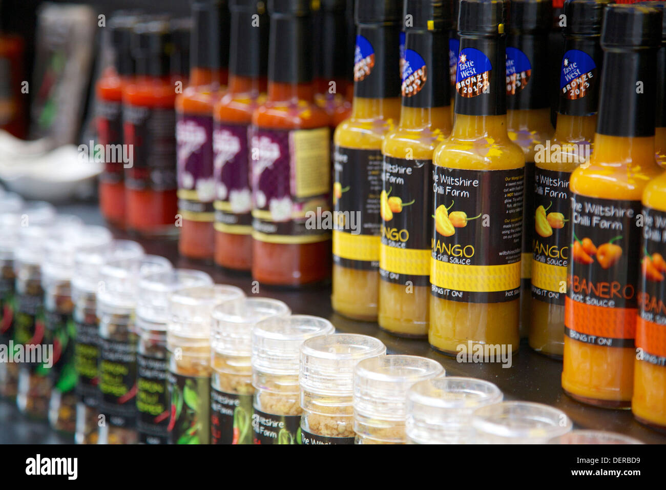 Bottled Chilli sauces Abergavenny Food Festival 2013 Stock Photo
