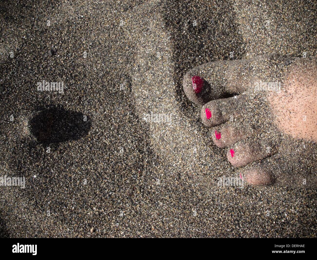 Feet buried in sand hi-res stock photography and images - Alamy