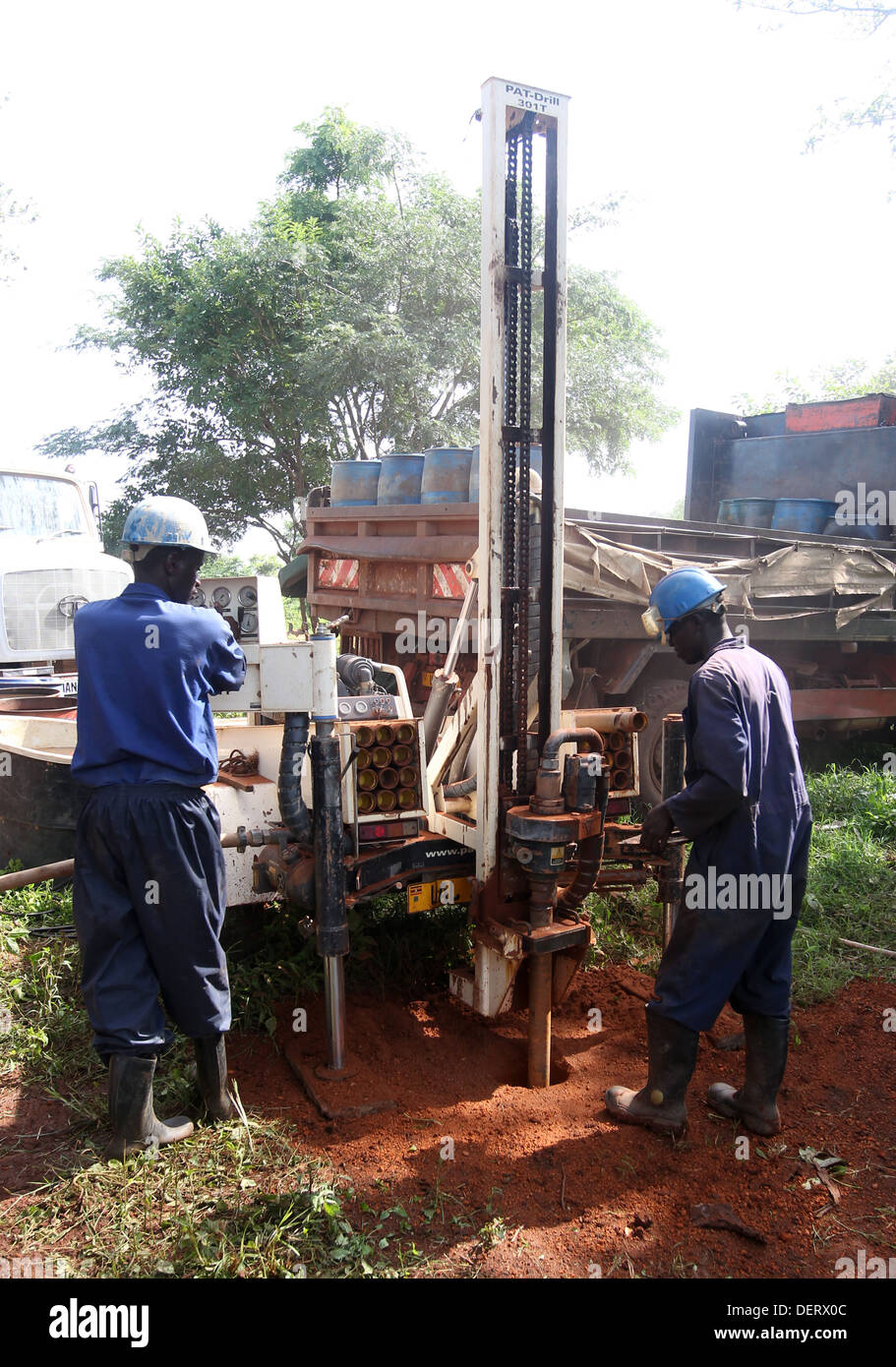 An NGO funded drilling team drill a cleaning drinking water well at a