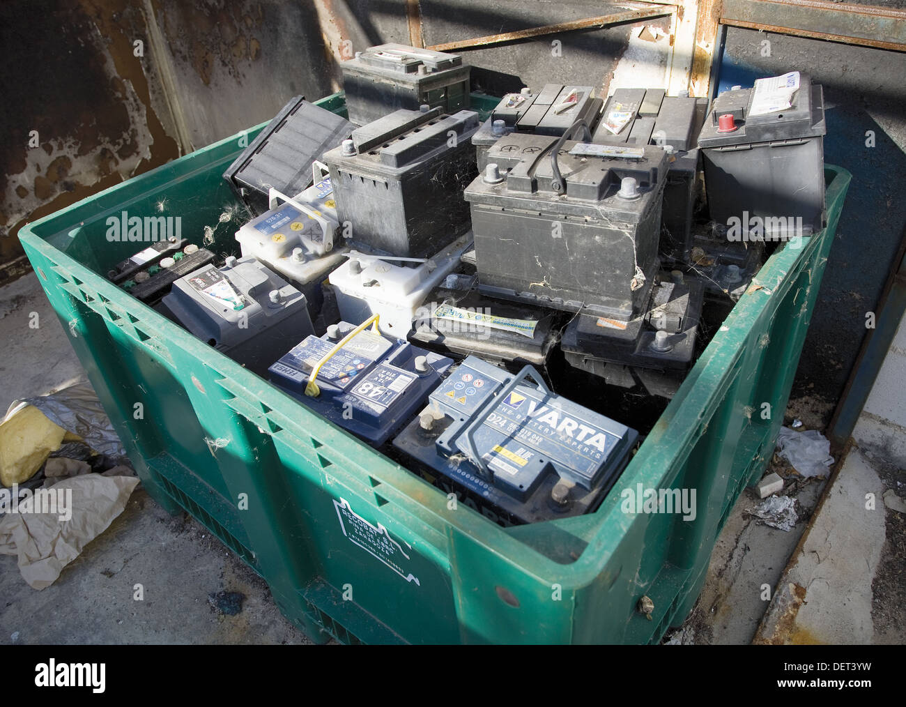 Car batteries in green recycling container Stock Photo Alamy