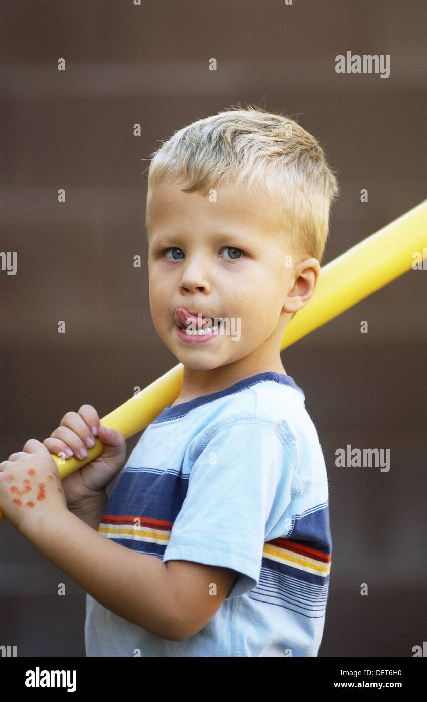 Young Boy holding toy baseball bat Stock Photo Alamy