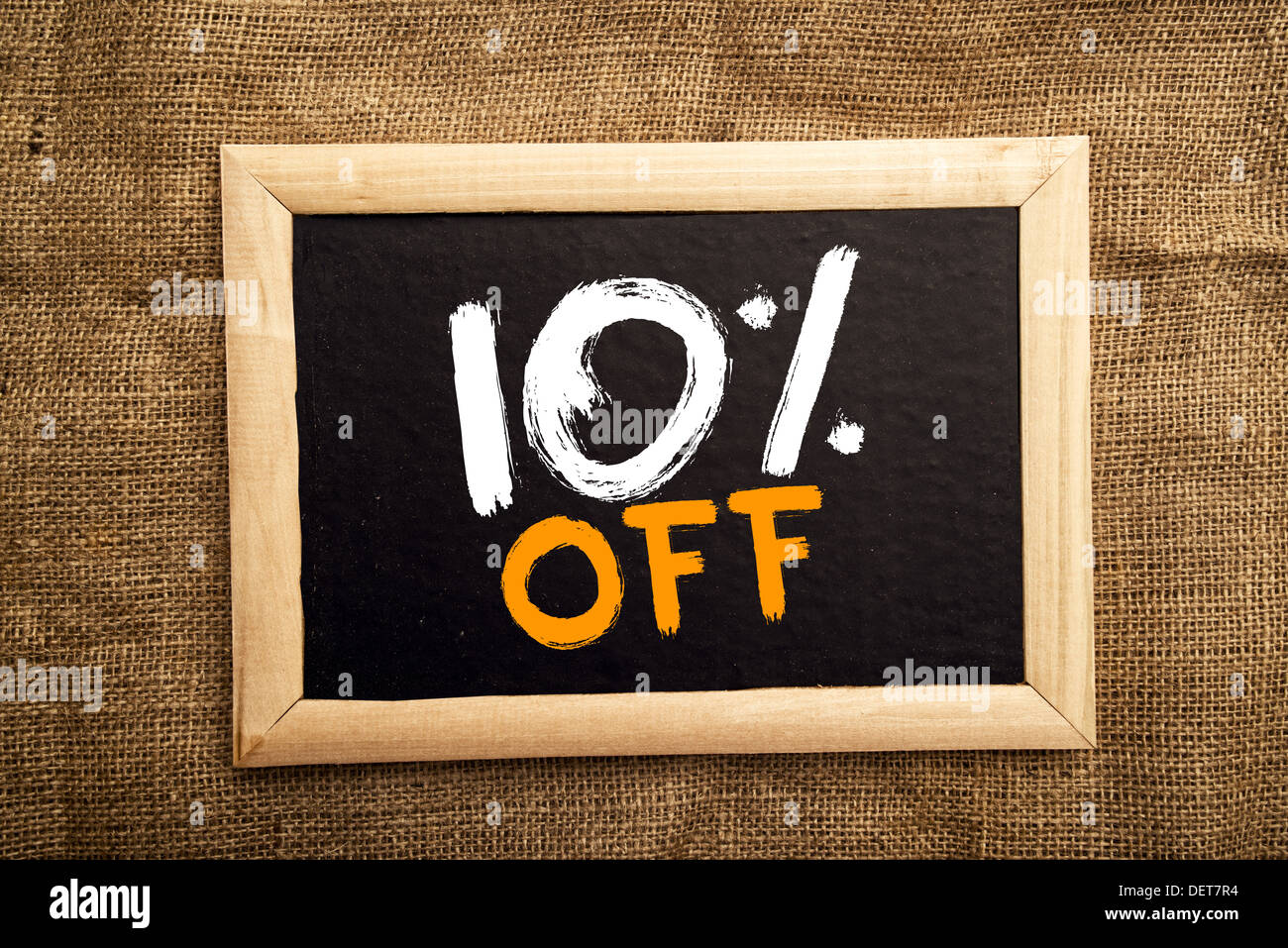 Ten percent off, discount tag on blackboard. Stock Photo