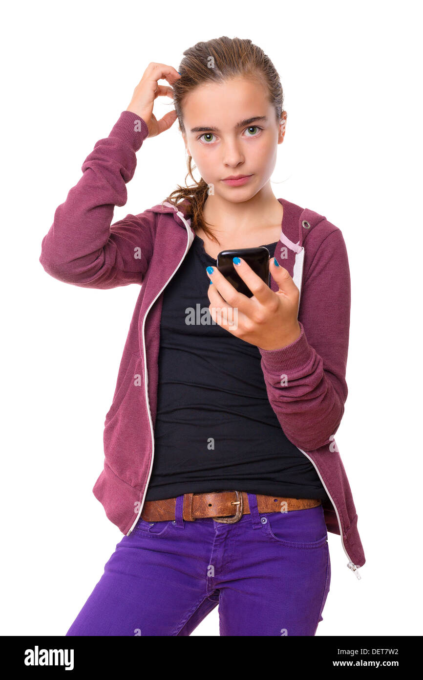 confused beautiful teenage girl with mobile phone, , isolated on white. Stock Photo