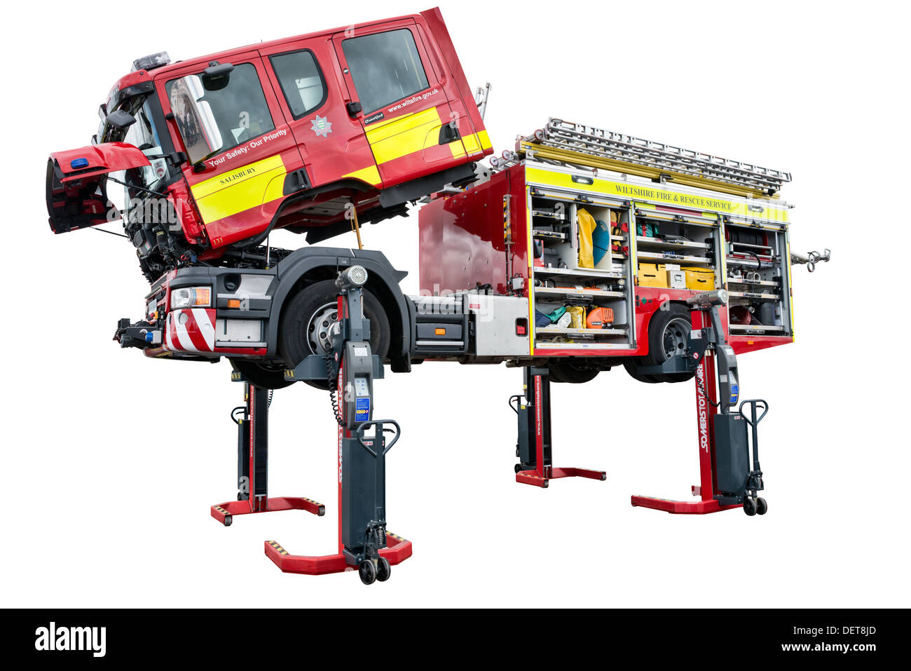 A cut out of a Scania fire engine hoisted aloft for inspection showing aspects of its emergency equipment Stock Photo