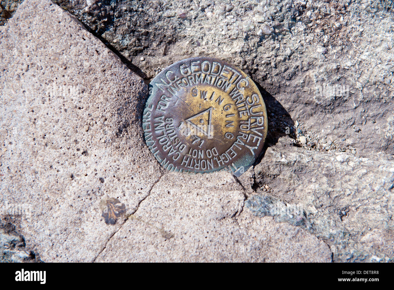 Geodetic survey marker set in rock atop Grandfather Mountain, North Carolina, USA. Stock Photo
