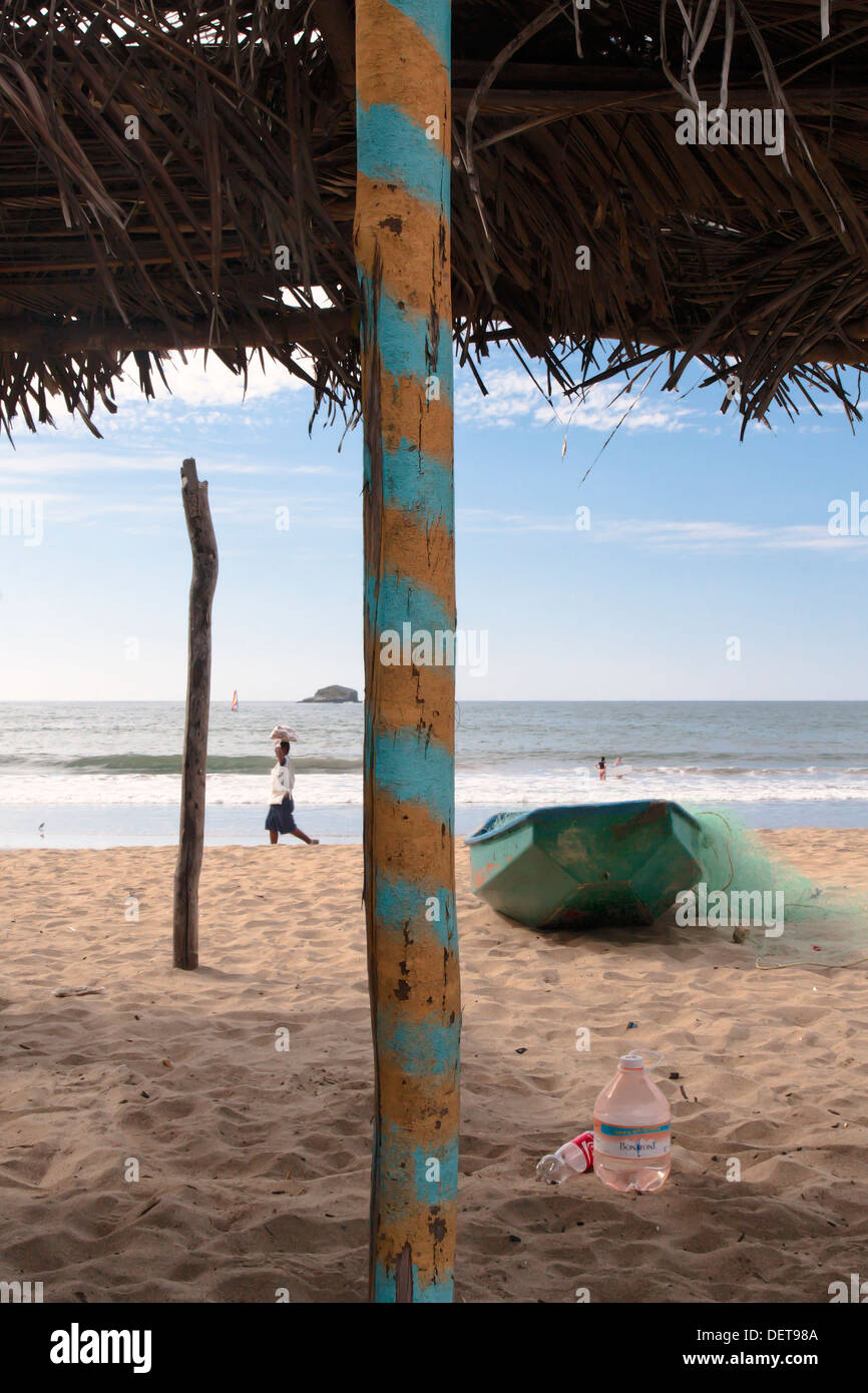 From under a palapa, view of the beach at Guayabitos, state of Nayarit, Mexico. Stock Photo