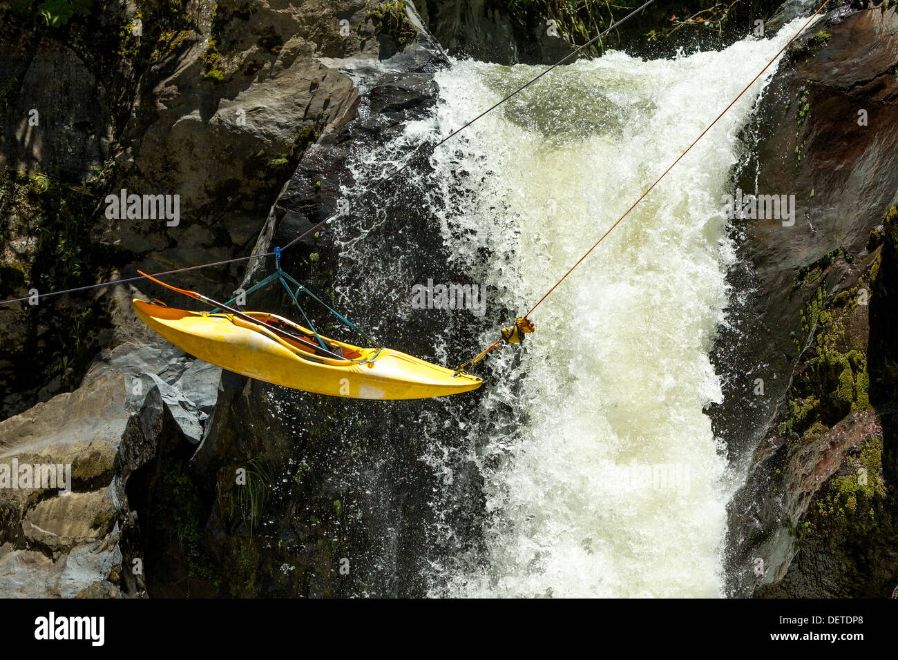 KAYAK SUSPENDED ON A ZIP LINE ZIPLINE EXTREME SPORT THEME Stock Photo