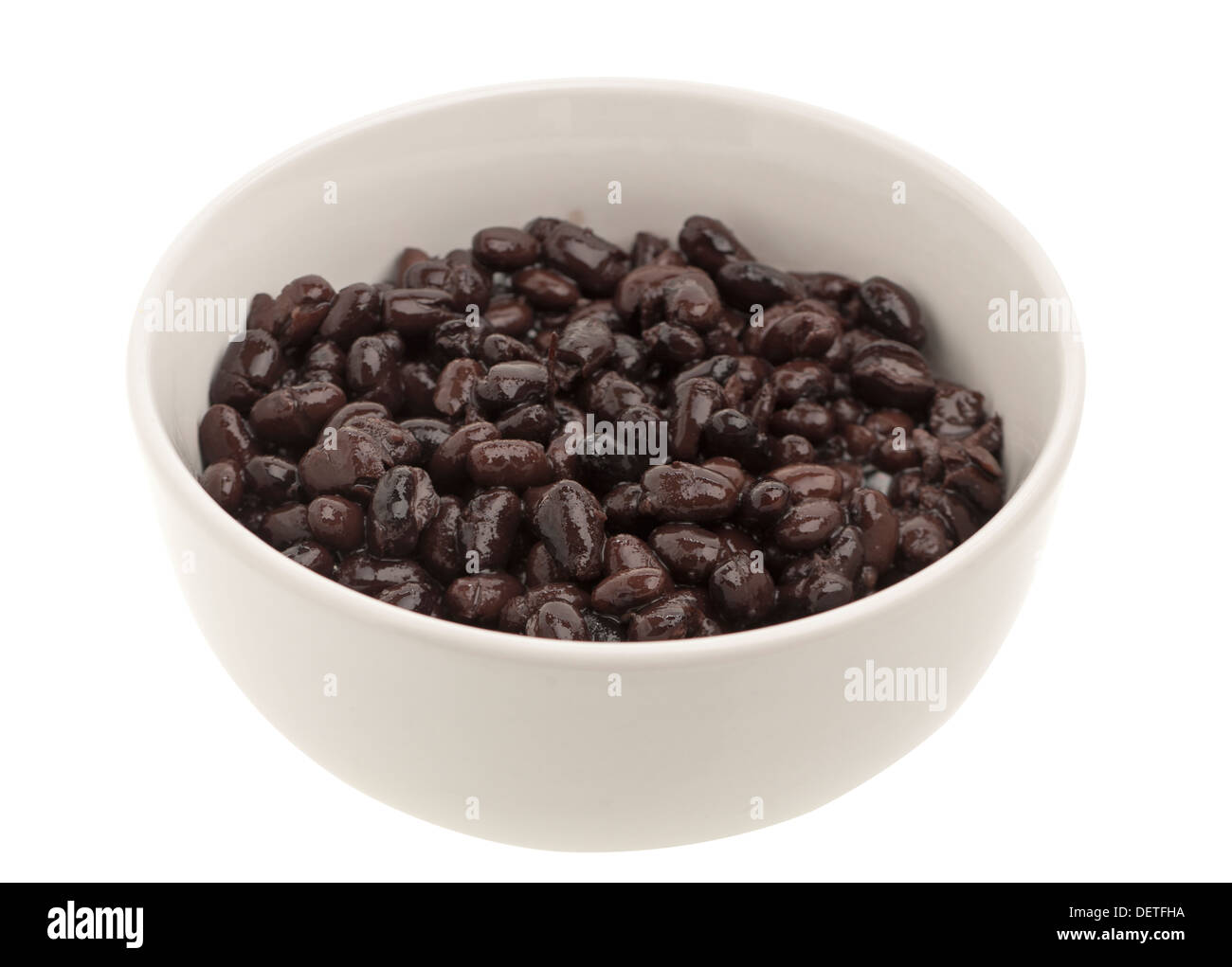 White dish full of cooked black beans Stock Photo