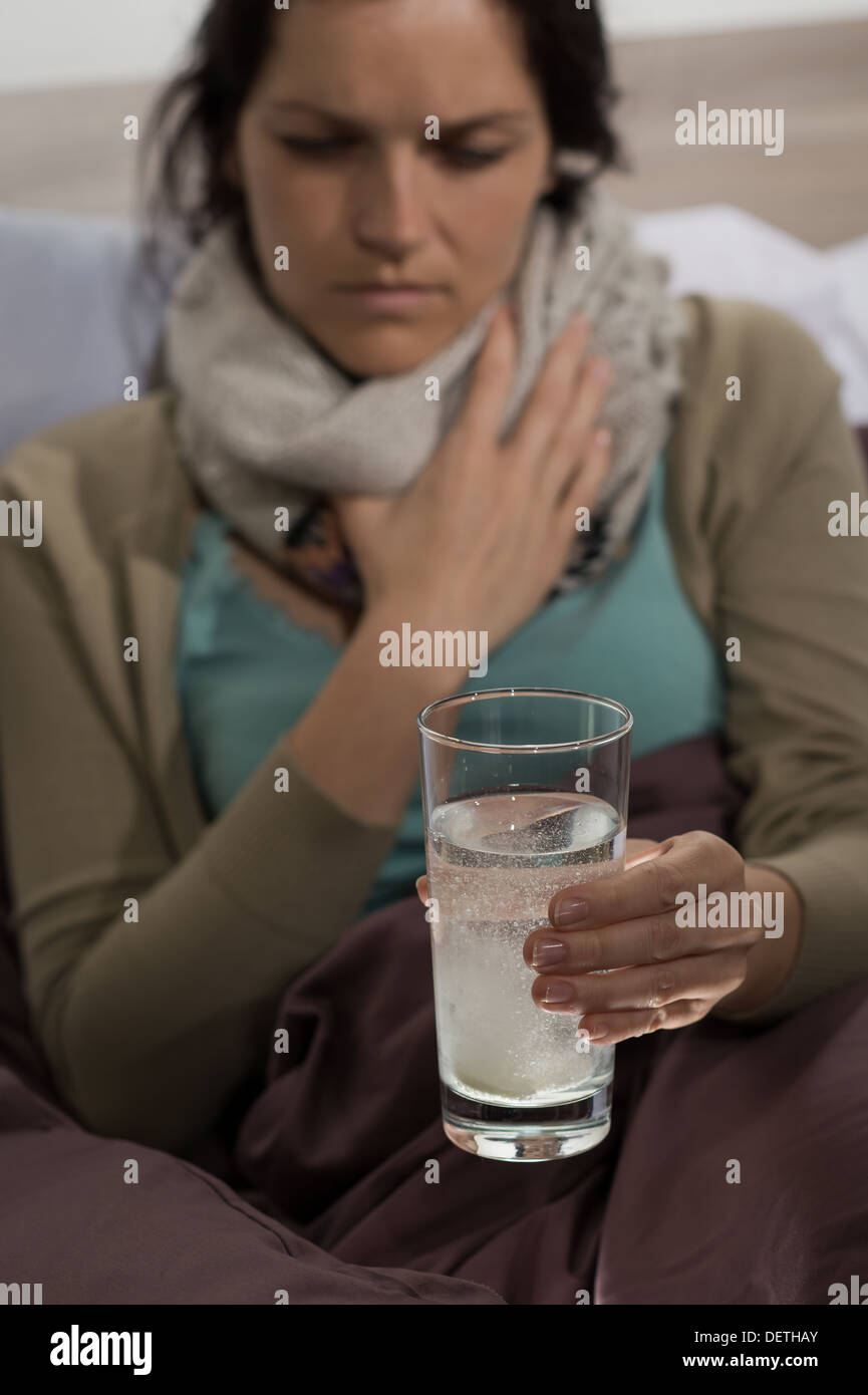 Sick woman preparing cold flu medicine to drink Stock Photo Alamy