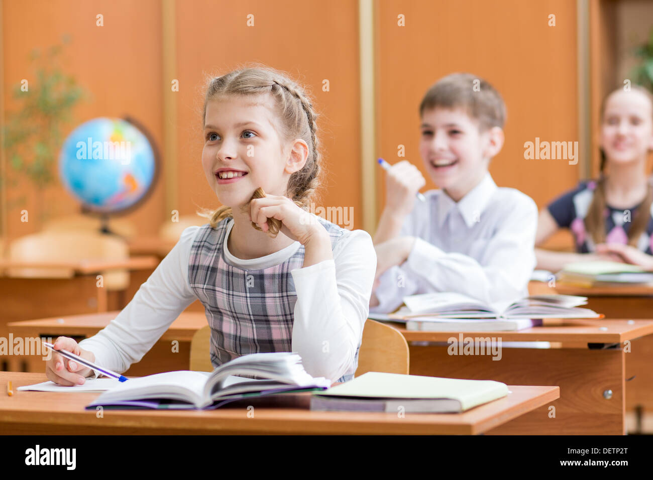 school children at lesson in classroom Stock Photo