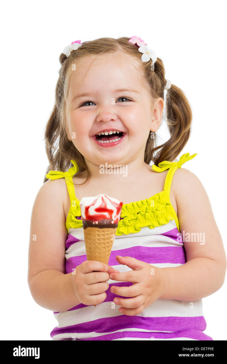 happy kid girl eating ice cream in studio isolated Stock Photo - Alamy