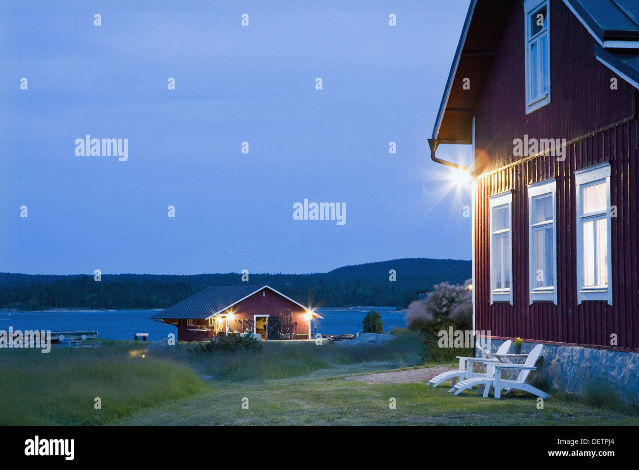 Finland, Aland Island Silverskär, private island Wood house at summer night Stock Photo