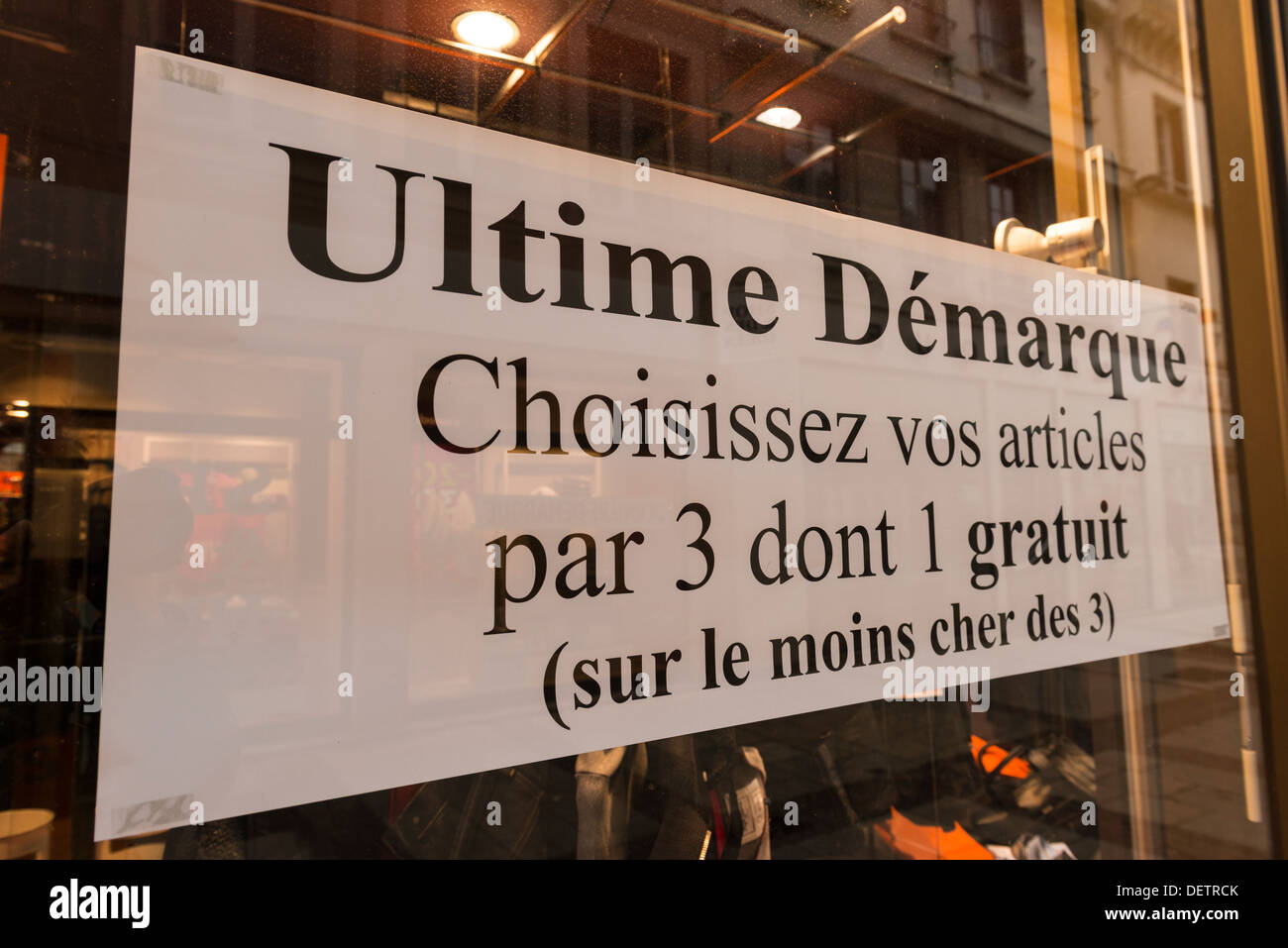 Sale sign on shop window, France Stock Photo