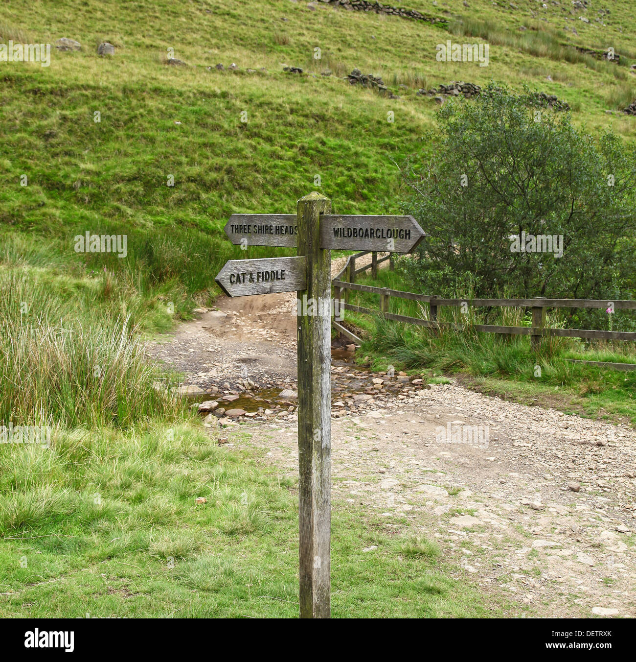 A wooden Footpath sign post near to Wildboarclough Cheshire saying to the Cat and Fiddle, Three Shires Head and Wildboarclough Stock Photo