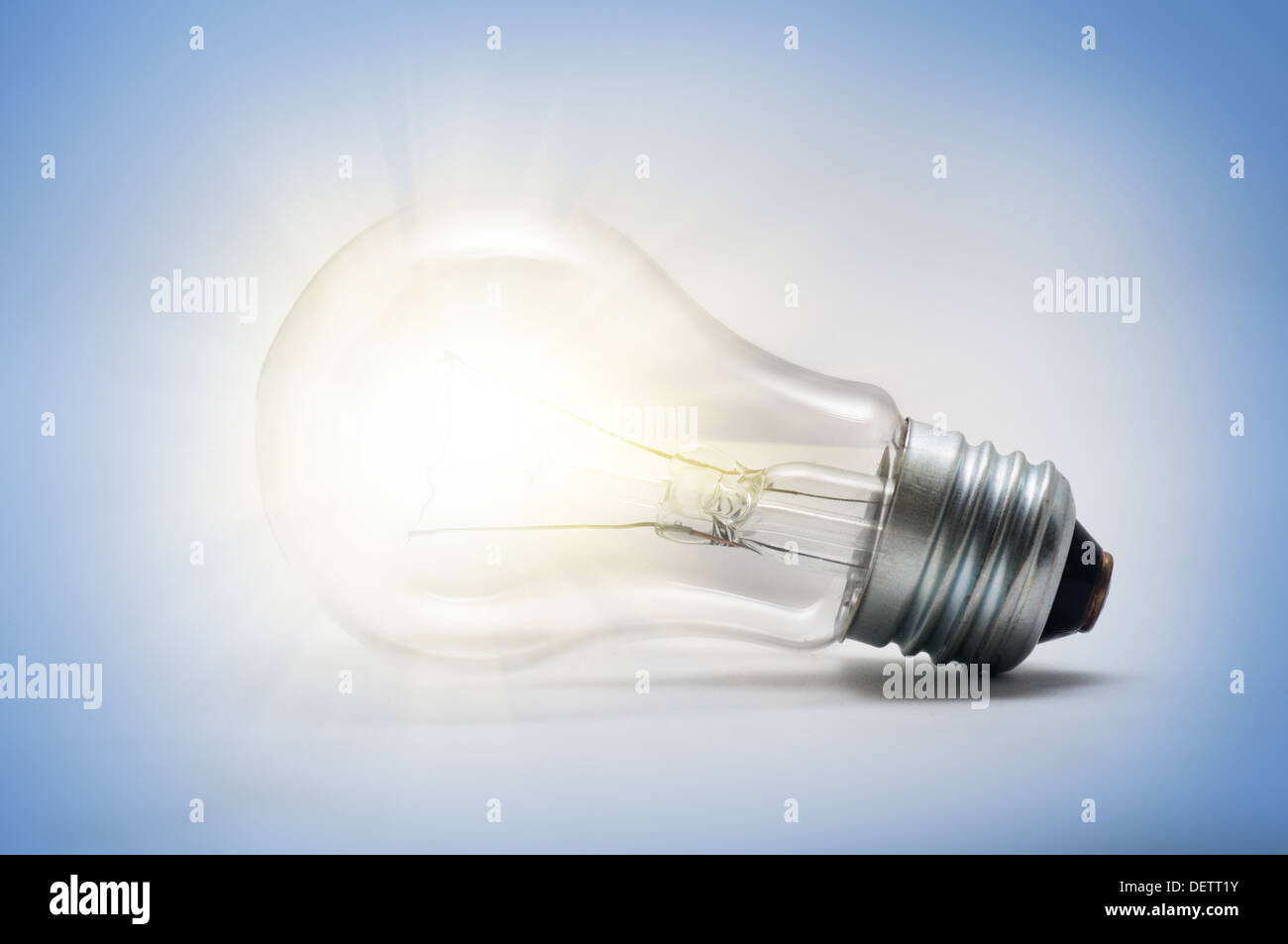 a light bulb on the blue background Stock Photo - Alamy