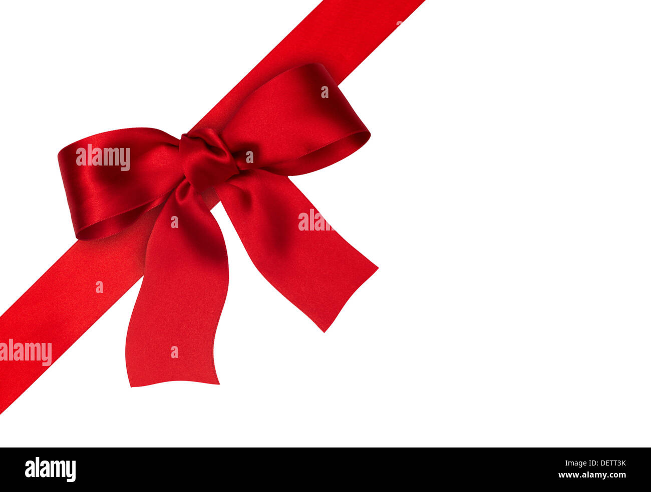 Thin, red and white ribbon is laid out on a plain white background