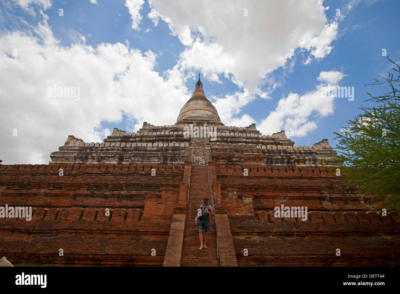 A man walks down a temple in Bagan, Burma. Stock Photo