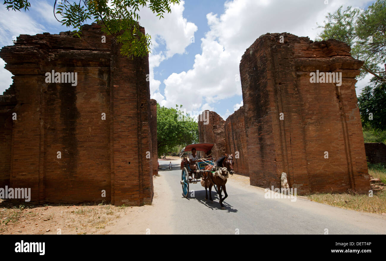 A horse cart rides through Tharaba Gate in Bagan. Stock Photo