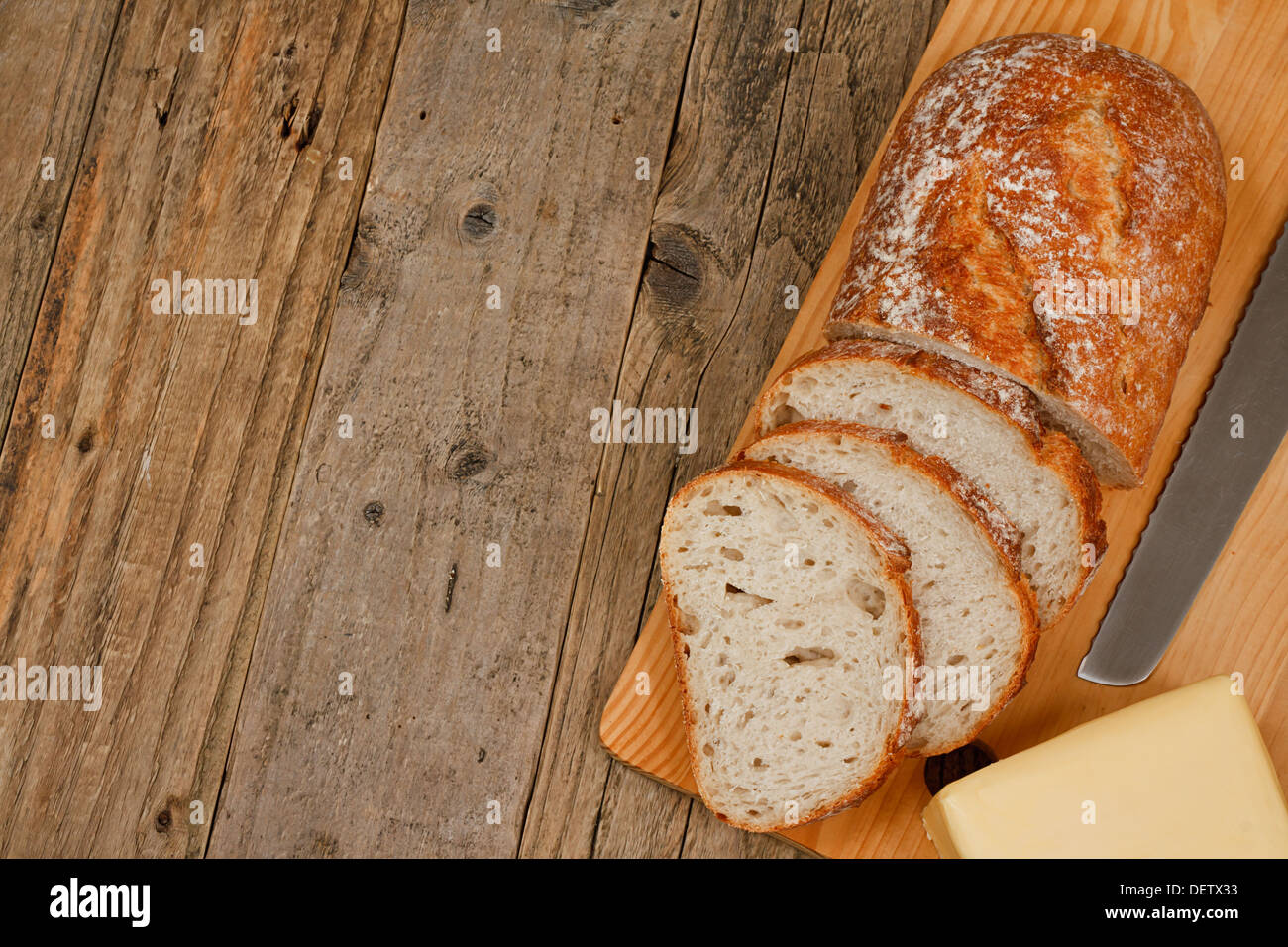 Traditional rustic farmhouse bread and butter background Stock Photo
