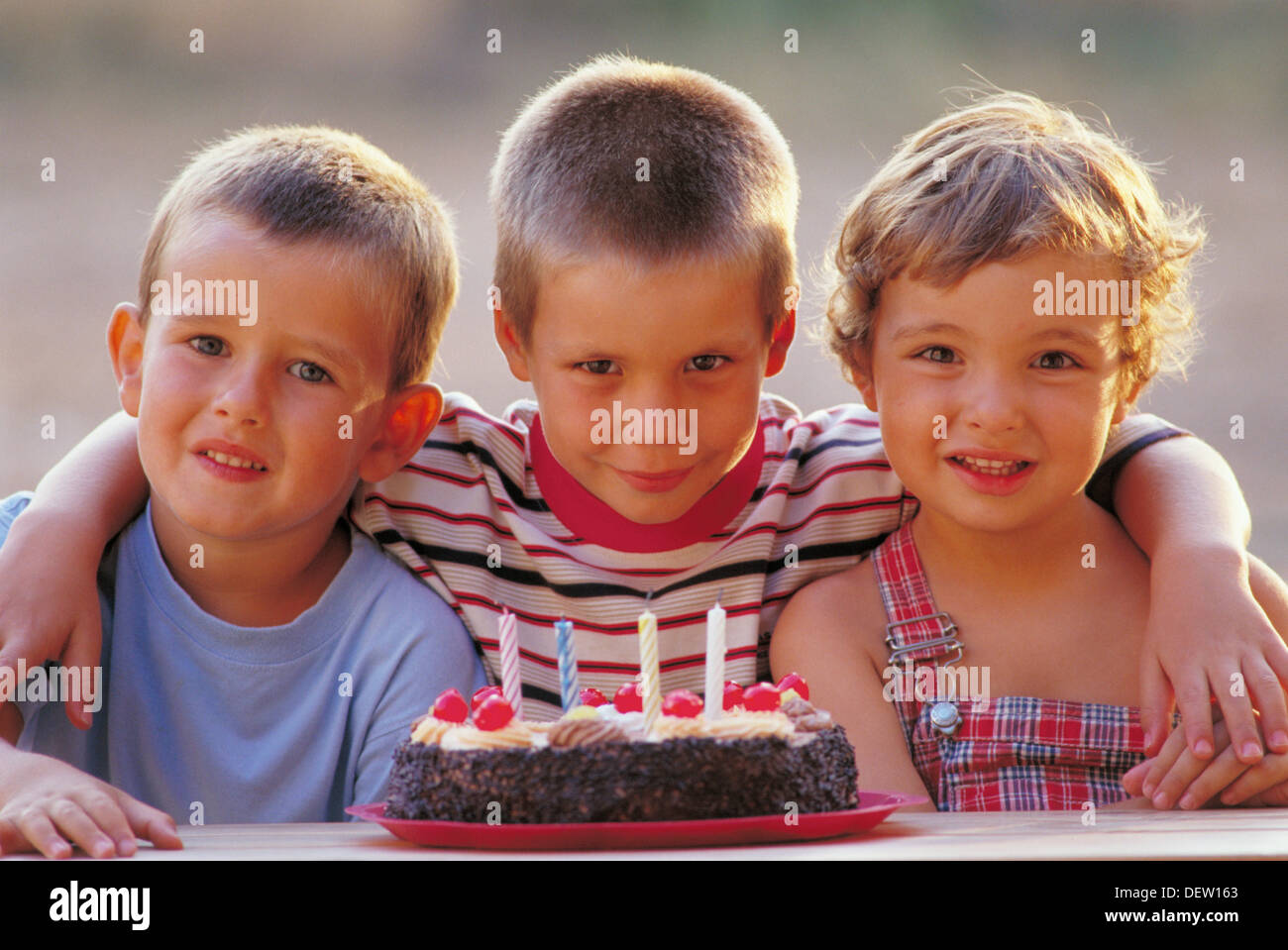 Children with birthday cake Stock Photo - Alamy