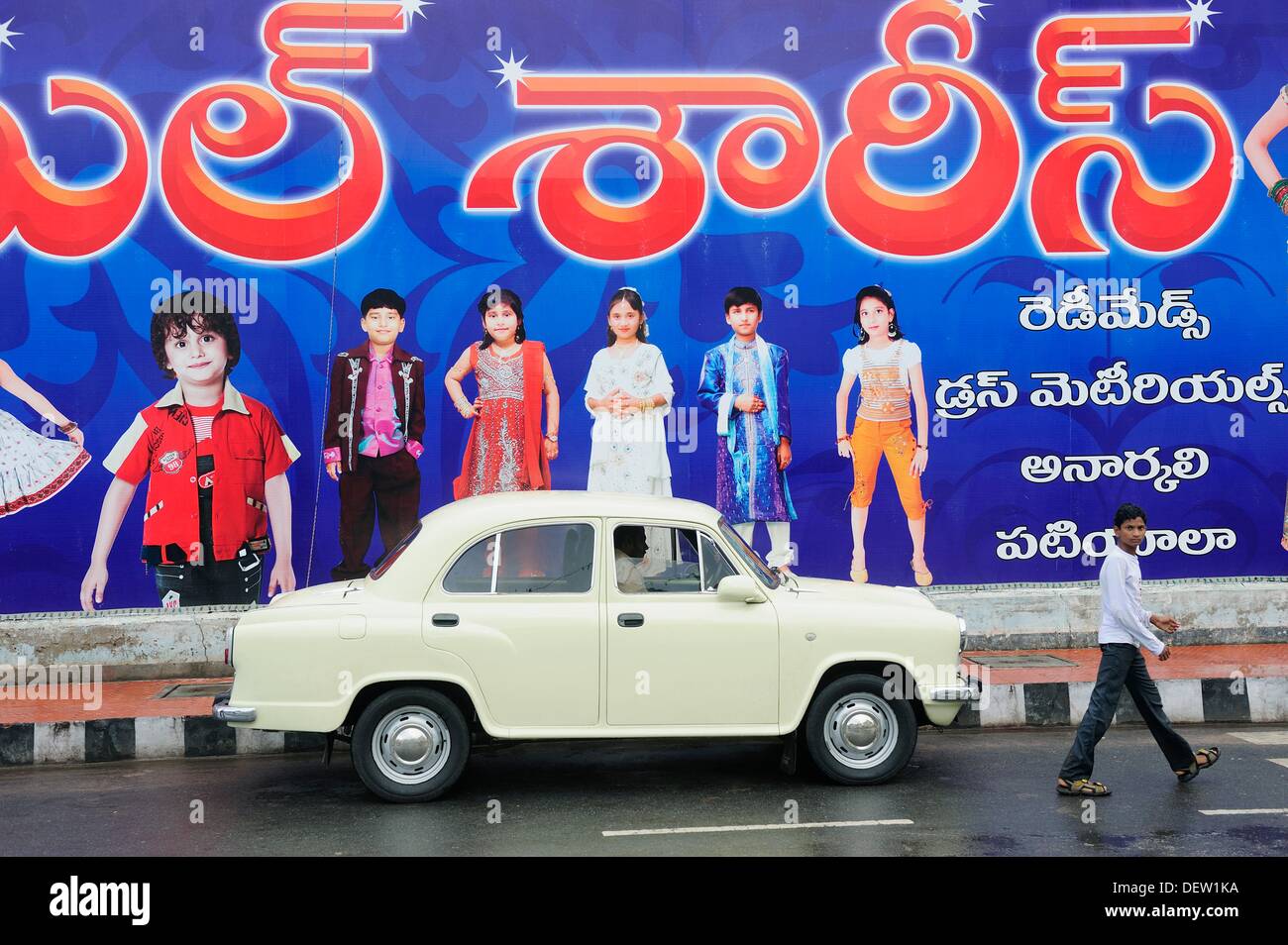 Asia,India ,Andhra Pradesh,Vijayawada,old ambassador car and advertising in a street Stock Photo