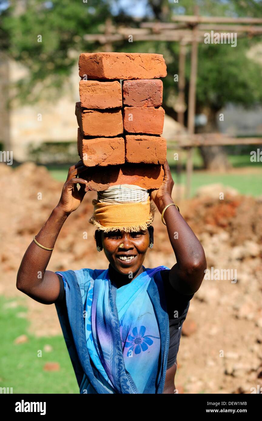 Carrying bricks on head hires stock photography and images Alamy