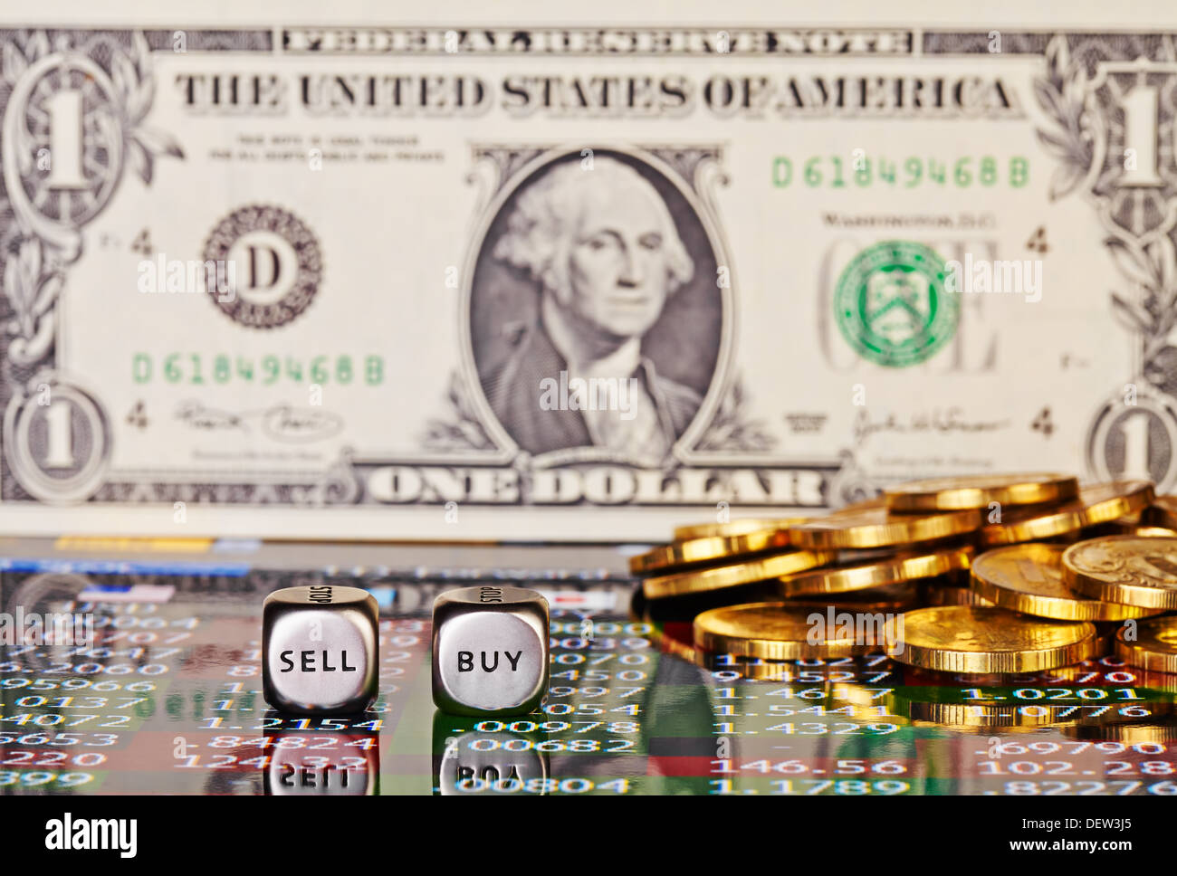 One dollar banknote,dices cubes with the words SELL BUY, golden coins and financial chart. Selective focus Stock Photo