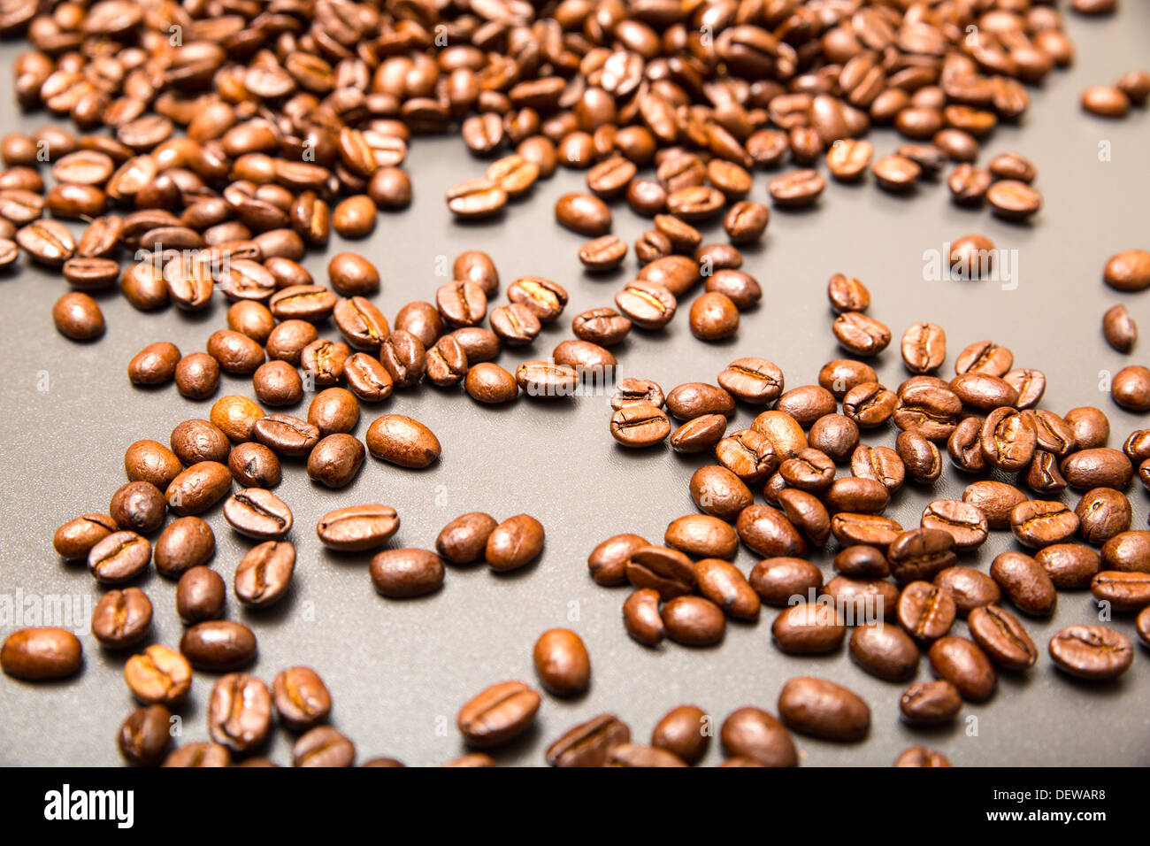 Roasted Coffee beans on a dark background Stock Photo - Alamy