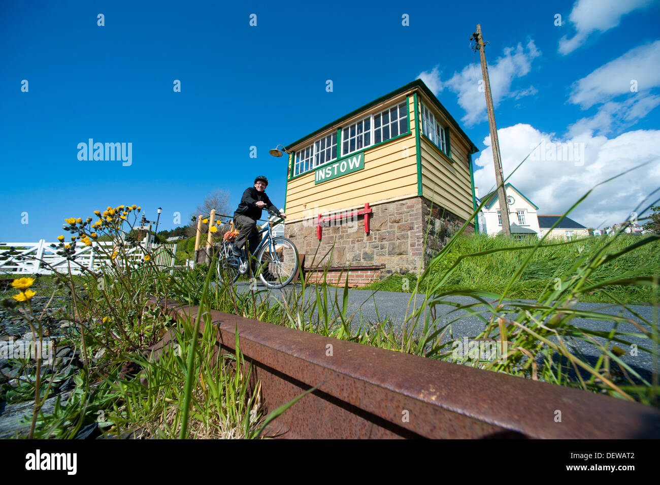 Cyclist passing old signal box at Instow, Devon on the Tarka Trail, England Stock Photo