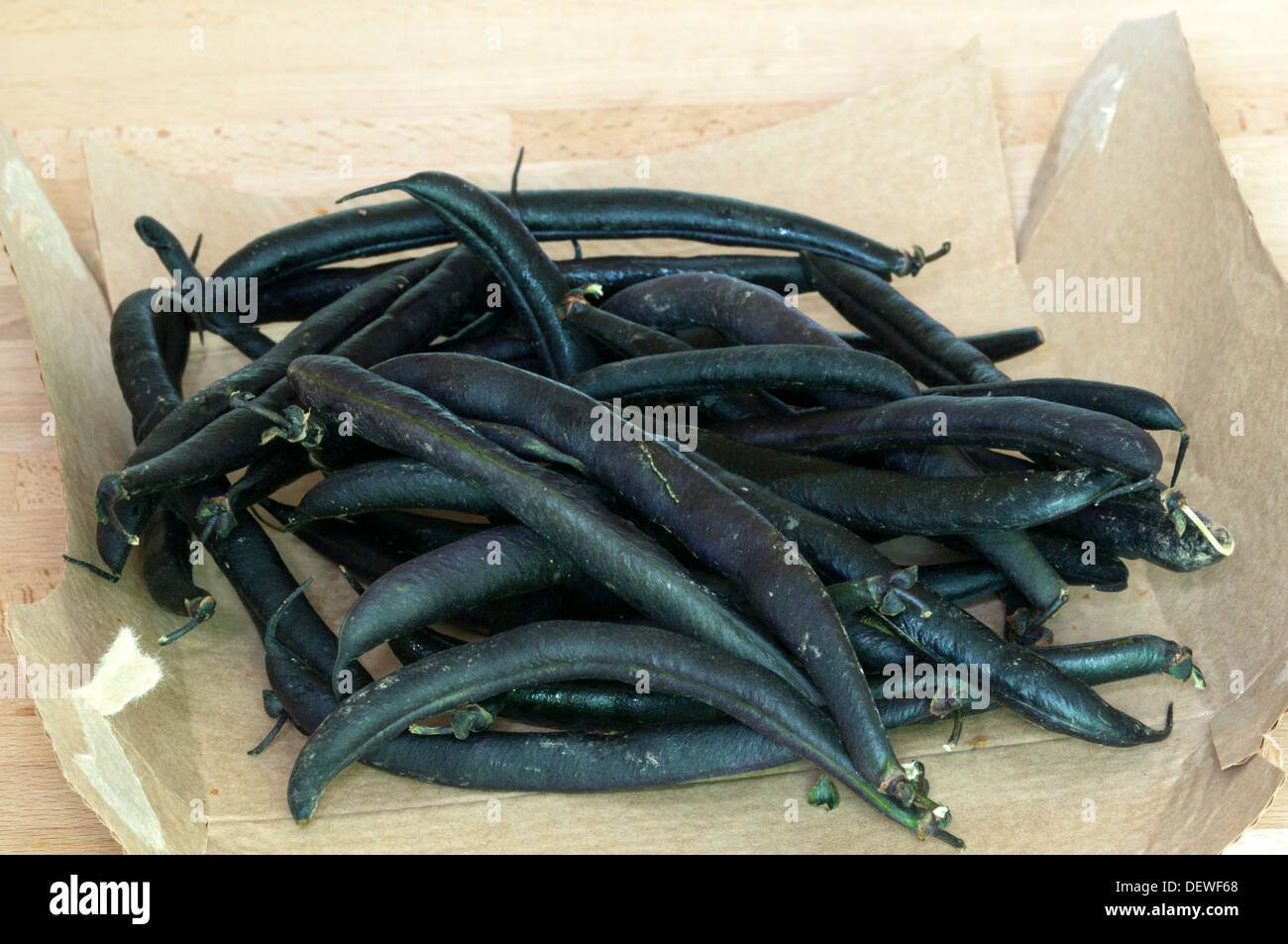 A pile of organic purple French beans. Stock Photo