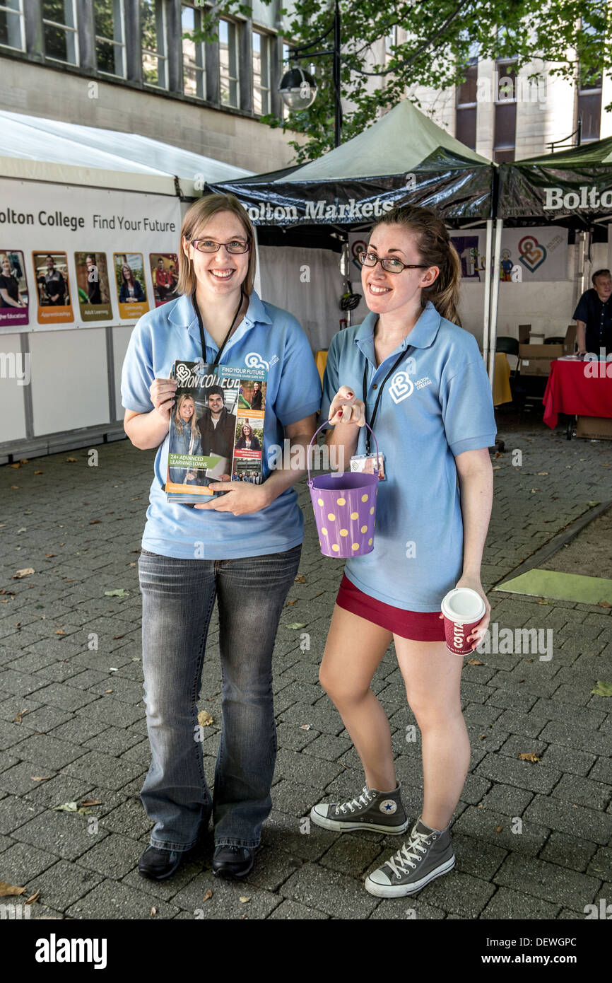 Two girls advertising Bolton College Stock Photo