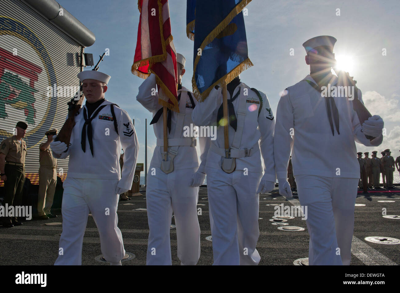 The color guard parades colors at the chief petty officer pinning ceremony aboard forward-deployed amphibious transport dock ship USS Denver (LPD 9). Denver is on patrol with the Bonhomme Richard Amphibious Ready Group and, with the embarked 31st Marine E Stock Photo