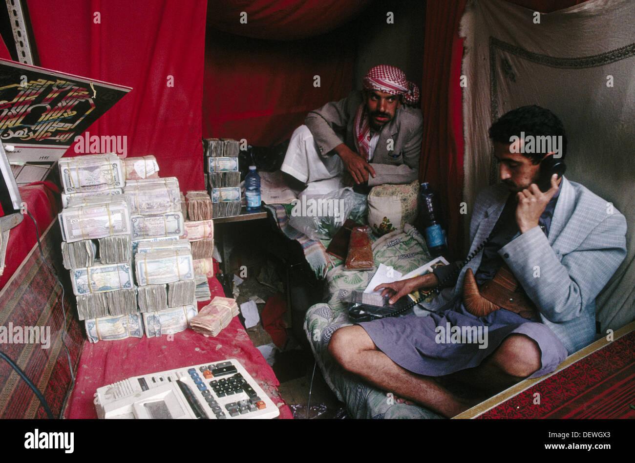 Moneychanger chewing cat (drug). Yemen Stock Photo Alamy