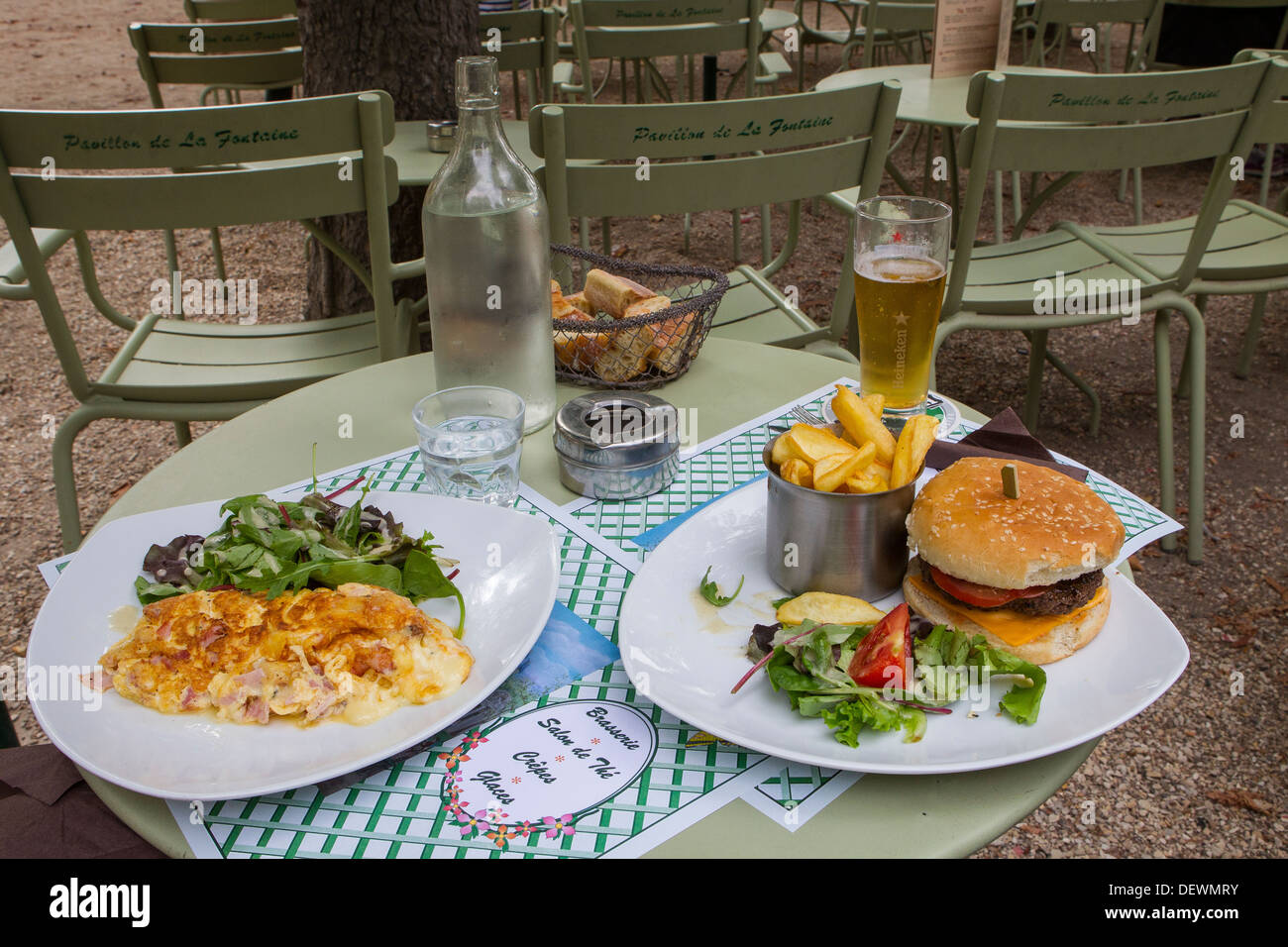 two plates of lunch omelette burger fries beer Stock Photo