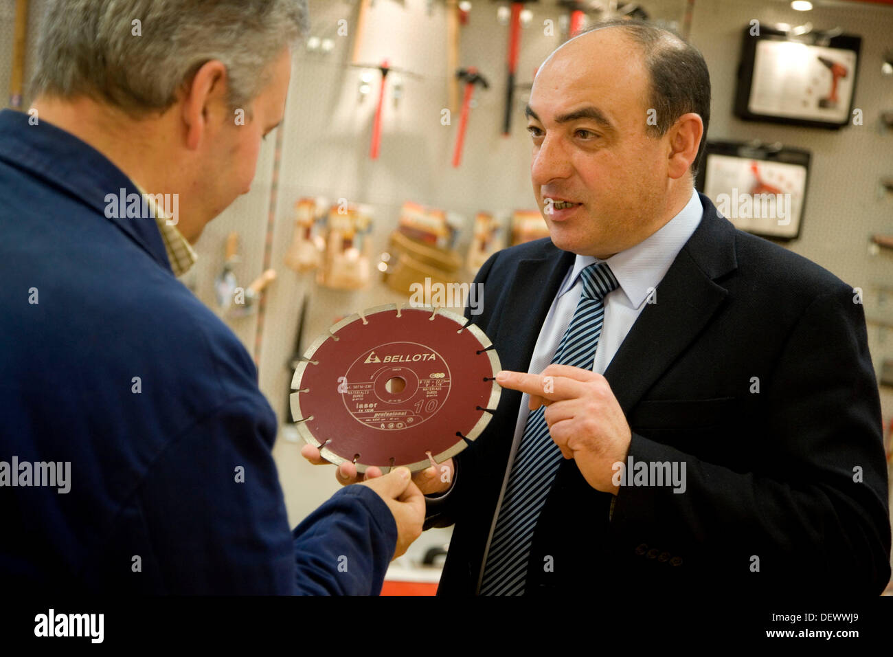 Salesman with diamond blade, construction machinery Stock Photo Alamy