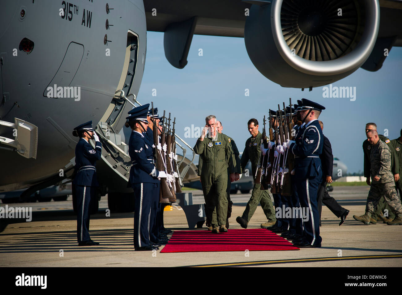 The Joint Base Charleston Honor Guard renders honors to Gen. Paul Selva, Air Mobility Command commander, during a delivery ceremony Sept. 12, 2013, on the flight line at Joint Base Charleston - Air Base, S.C. This historical event comes more than 20 years Stock Photo