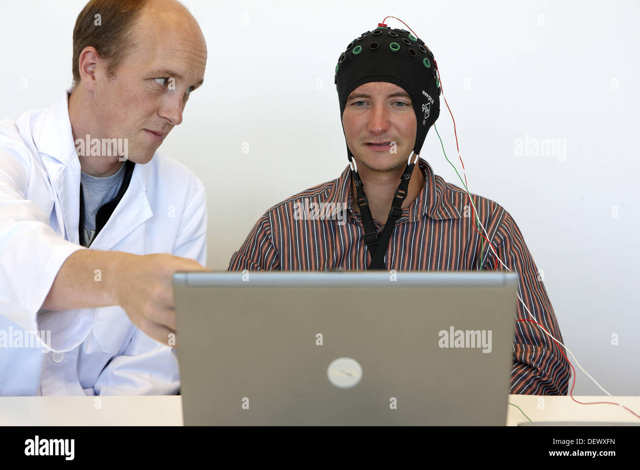 Testing a BCI (Brain-Computer Interface) developed by Health and Quality of life Unit researchers, FIK technology research Stock Photo