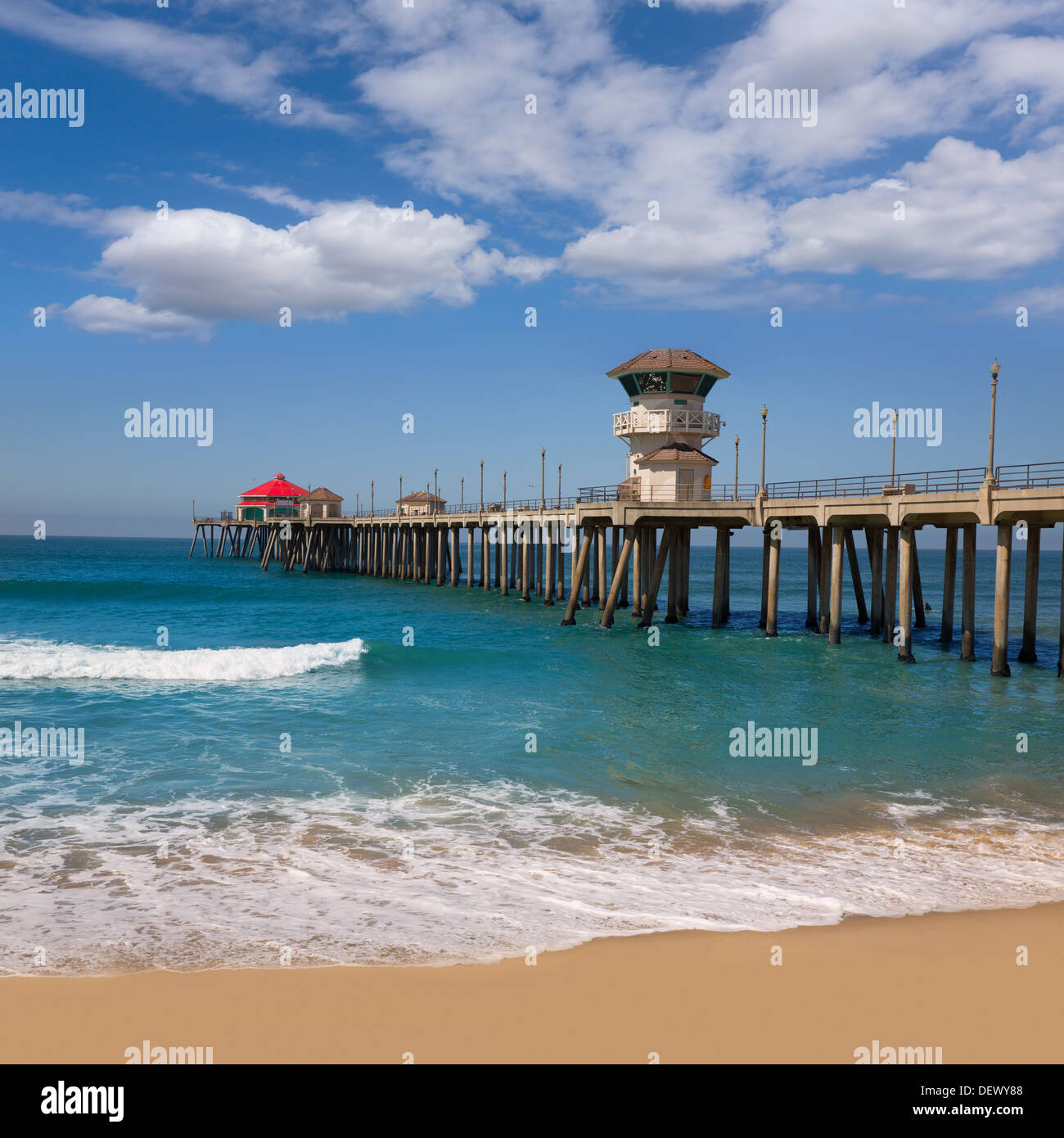 Huntington beach Surf City USA pier view with sand and waves Stock Photo