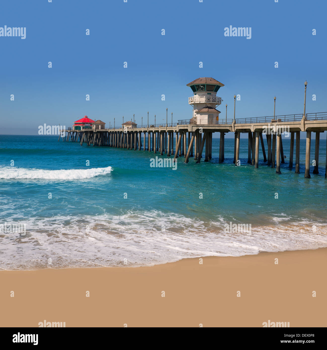 Huntington beach Surf City USA pier view with sand and waves Stock Photo